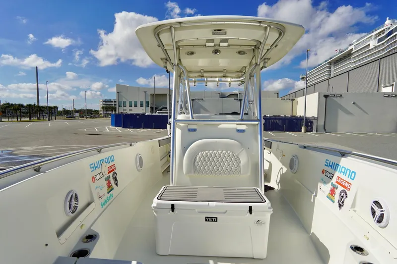 Slide: The Image of 2009 Sailfish 2860 CC boat interior with Yeti cooler and fishing gear. - 16