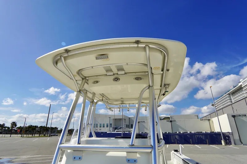 Slide: The Image of 2009 Sailfish 2860 CC boat with T-top under clear blue sky. - 17