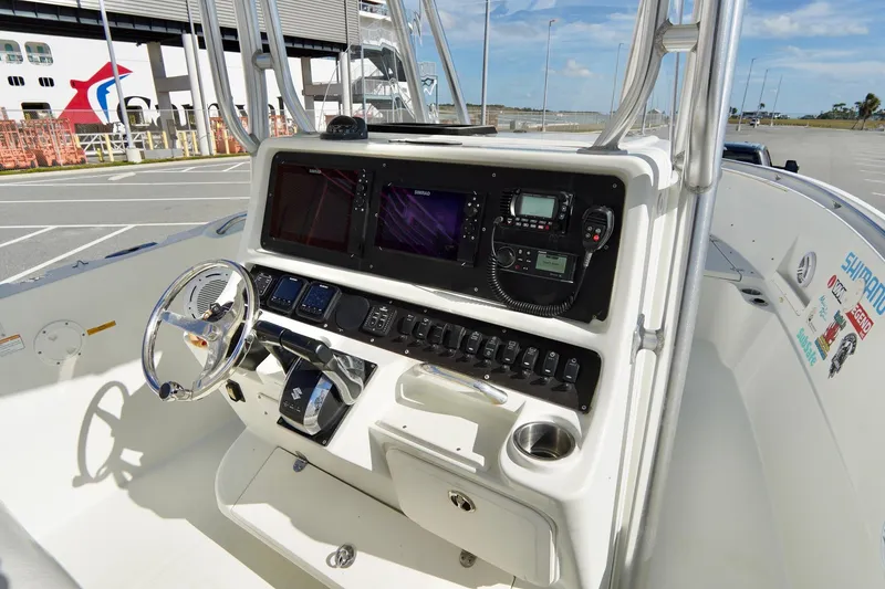 Slide: The Image of 2009 Sailfish 2860 CC boat console with steering wheel and navigation equipment. - 18