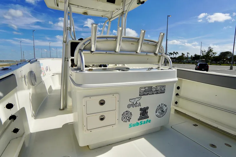 Slide: The Image of 2009 Sailfish 2860 CC boat interior with rod holders and storage compartments. - 27
