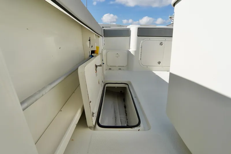 Slide: The Image of 2009 Sailfish 2860 CC boat interior with open storage compartment. - 28