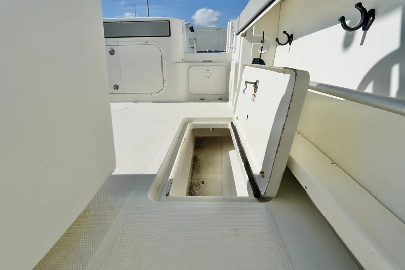 Slide: The Image of 2009 Sailfish 2860 CC boat deck with open storage compartment. - 29
