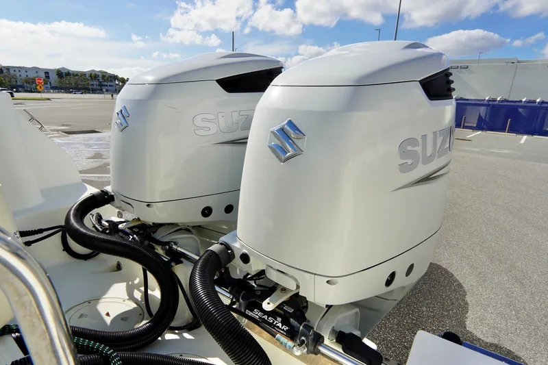Slide: The Image of Twin Suzuki outboard motors on a 2009 Sailfish 2860 CC boat. - 34