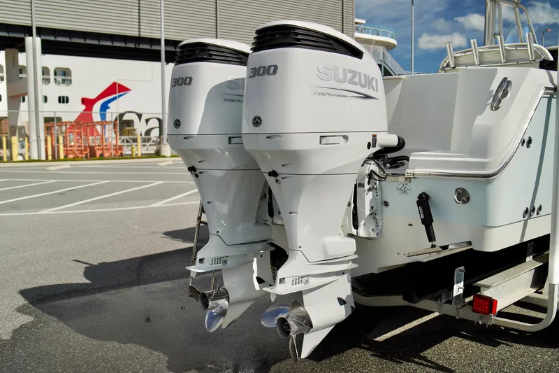 Slide: The Image of 2009 Sailfish 2860 CC boat with twin Suzuki 300 outboard engines. - 38