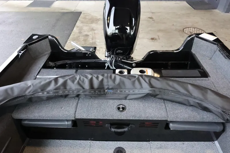 Slide: The Image of 2025 Lowe Fish & Ski FS 1625 boat interior with motor and seating area. - 11