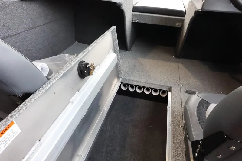 Slide: The Image of 2025 Lowe Fish & Ski FS 1625 interior with storage compartment and seating. - 12