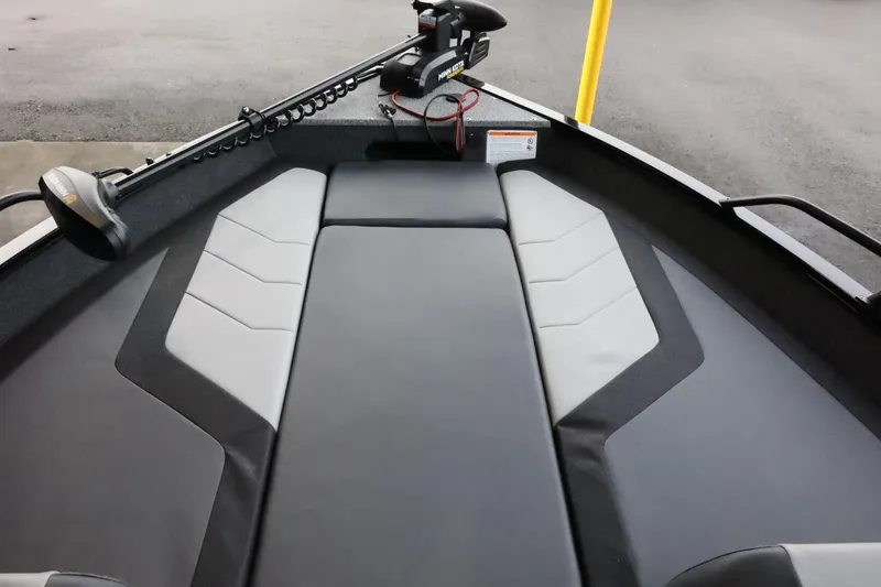 Slide: The Image of 2025 Lowe Fish & Ski FS 1625 boat interior with sleek seating and trolling motor. - 15