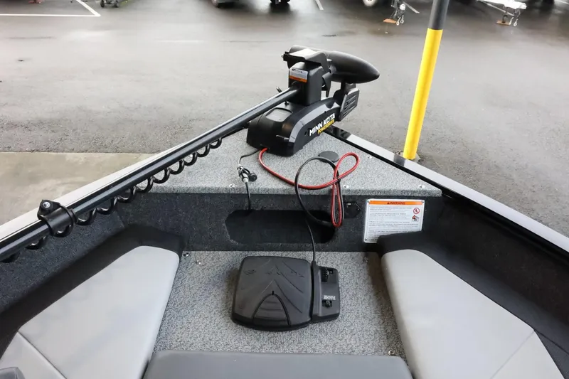 Slide: The Image of 2025 Lowe Fish & Ski FS 1625 boat interior with trolling motor and foot pedal. - 16