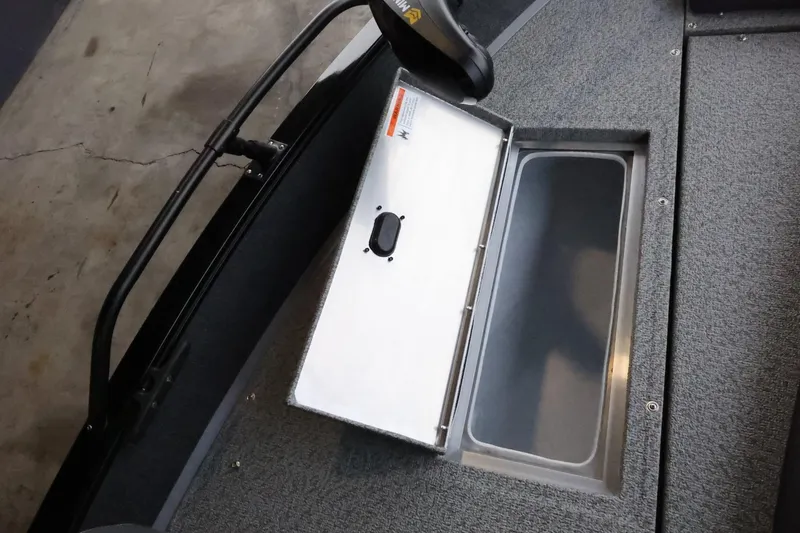 Slide: The Image of 2025 Lowe Fish & Ski FS 1625 boat storage compartment with open lid. - 20