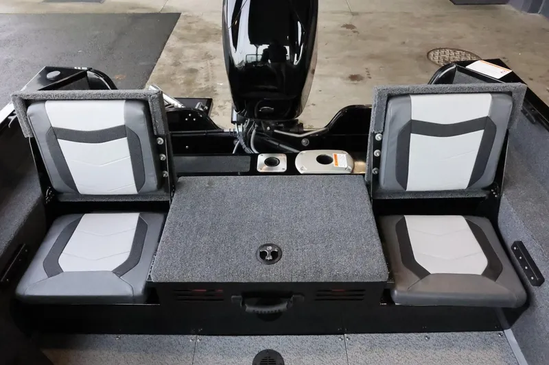 Slide: The Image of 2025 Lowe Fish & Ski FS 1625 boat interior with dual seats and motor. - 25