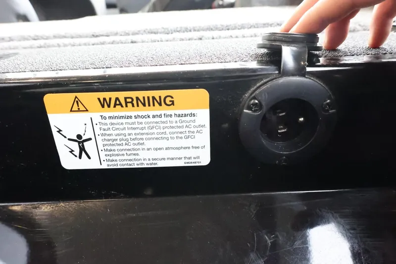 Slide: The Image of Warning label on 2025 Lowe Fish & Ski FS 1625 boat, highlighting electrical safety. - 30