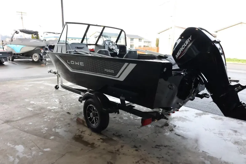 Slide: The Image of 2025 Lowe Fish & Ski FS 1625 boat with Mercury engine on trailer. - 6