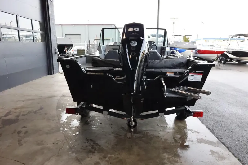 Slide: The Image of 2025 Lowe Fish & Ski FS 1625 boat with 60 HP motor in showroom. - 7