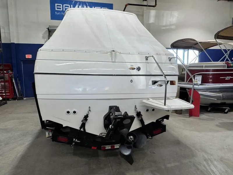 Slide: The Image of Rear view of 2000 Bayliner 2252 Ciera Express boat in showroom. - 15