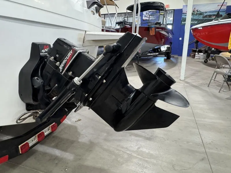 Slide: The Image of Bayliner 2252 Ciera Express 2000 with Mercury outboard motor in showroom. - 20