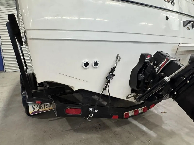 Slide: The Image of Rear view of 2000 Bayliner 2252 Ciera Express boat on trailer in garage. - 21