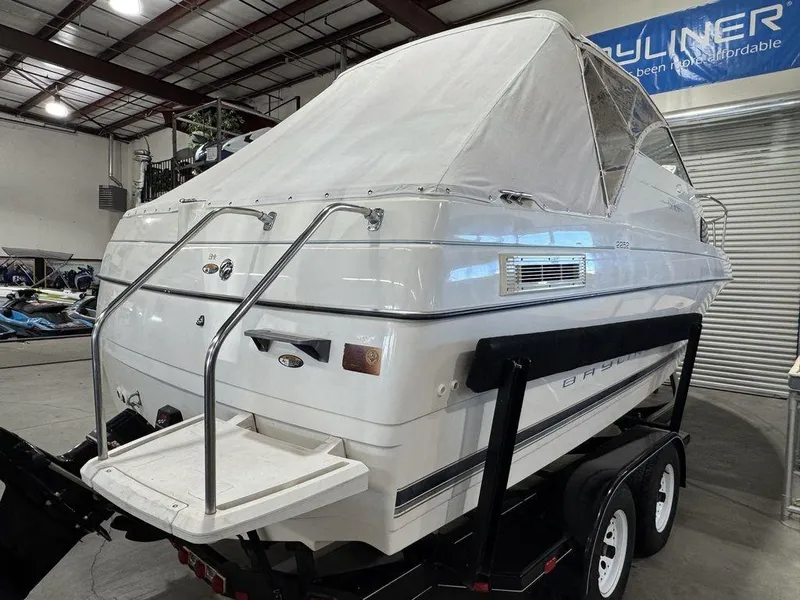 Slide: The Image of 2000 Bayliner 2252 Ciera Express boat on trailer in indoor storage. - 24