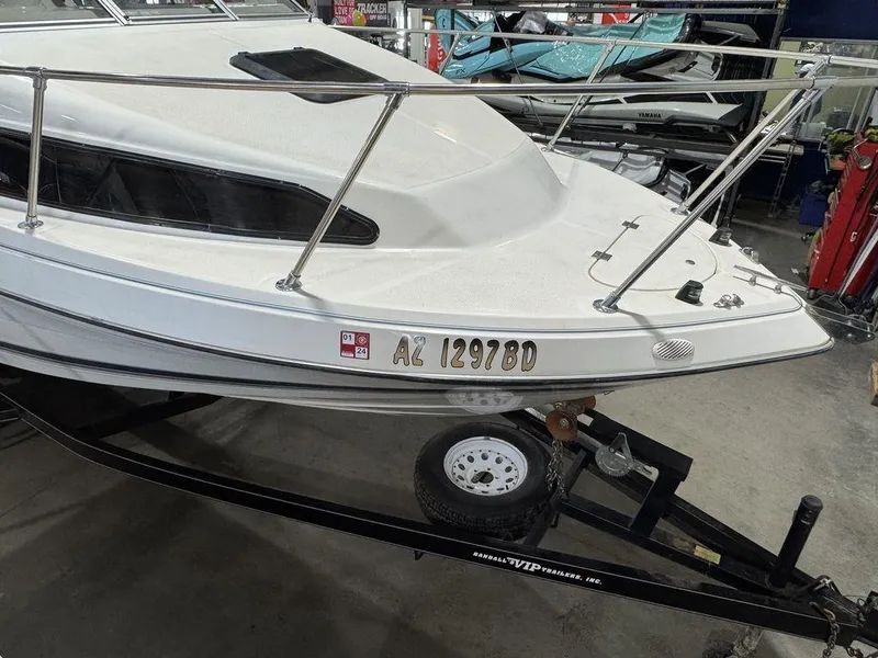 Slide: The Image of 2000 Bayliner 2252 Ciera Express boat on trailer in garage setting. - 30
