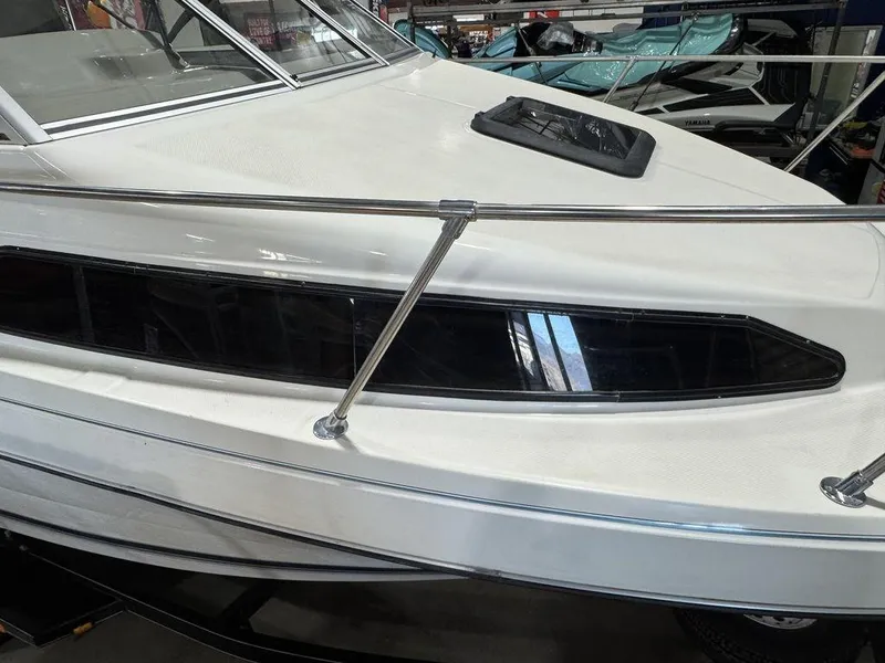 Slide: The Image of Bayliner 2252 Ciera Express 2000 model, white exterior, docked indoors. - 31