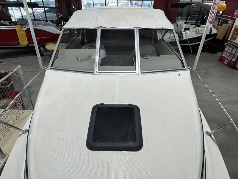 Slide: The Image of 2000 Bayliner 2252 Ciera Express boat with white exterior in showroom. - 35