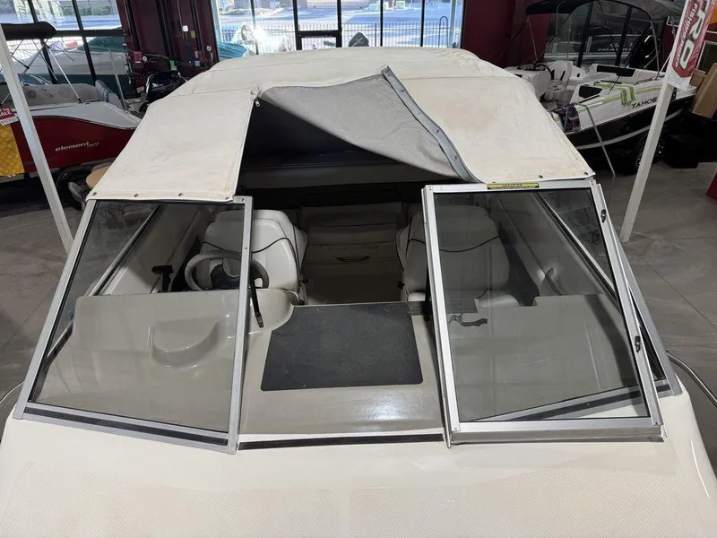 Slide: The Image of 2000 Bayliner 2252 Ciera Express boat with open windshield and covered cabin. - 38