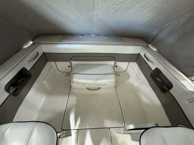 Slide: The Image of 2000 Bayliner 2252 Ciera Express boat interior with seating and storage. - 39