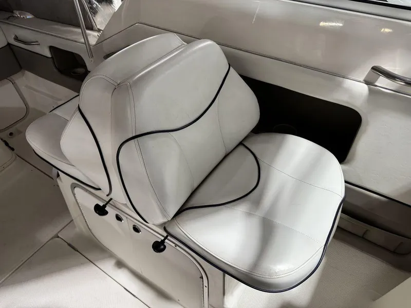 Slide: The Image of 2000 Bayliner 2252 Ciera Express interior with white cushioned seating. - 42
