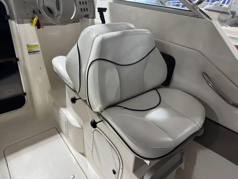 Slide: The Image of 2000 Bayliner 2252 Ciera Express interior with white leather seating. - 43