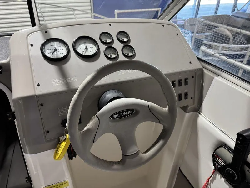 Slide: The Image of Steering wheel and dashboard of 2000 Bayliner 2252 Ciera Express boat. - 46