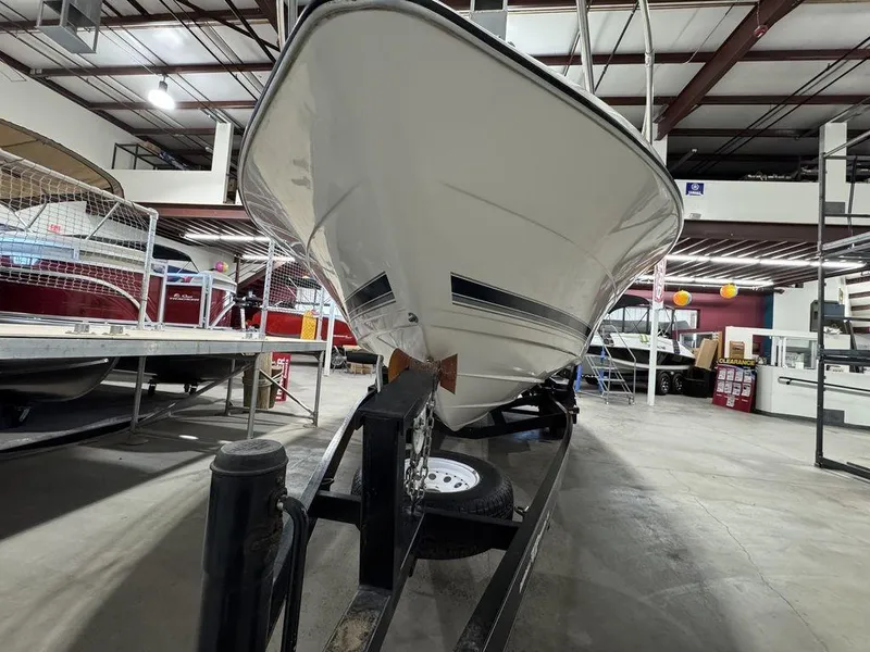 Slide: The Image of 2000 Bayliner 2252 Ciera Express boat on trailer in indoor storage facility. - 6