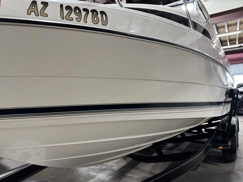 Slide: The Image of 2000 Bayliner 2252 Ciera Express boat on trailer, side view, registration AZ 1297BD. - 7