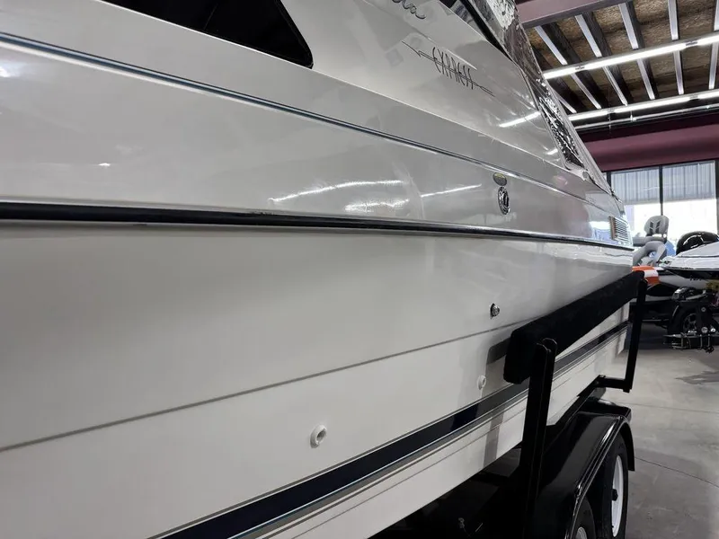 Slide: The Image of 2000 Bayliner 2252 Ciera Express boat on trailer in indoor storage. - 9