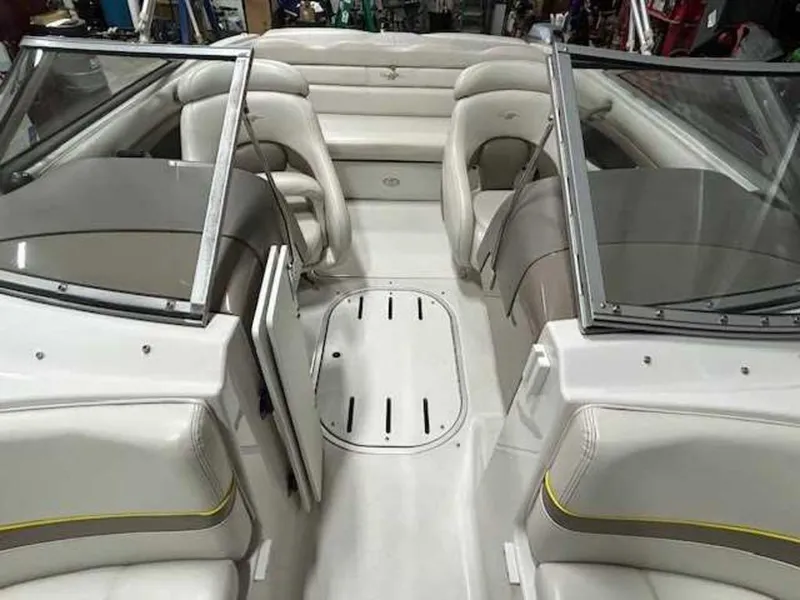 Slide: The Image of 2003 Four Winns 190 Horizon boat interior with white seating and open bow area. - 10