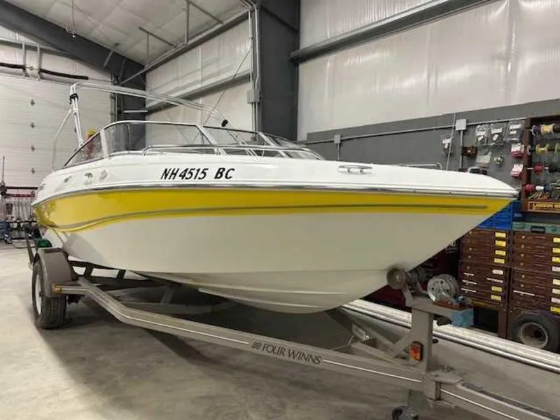 Slide: The Image of 2003 Four Winns 190 Horizon boat on trailer in garage. - 13