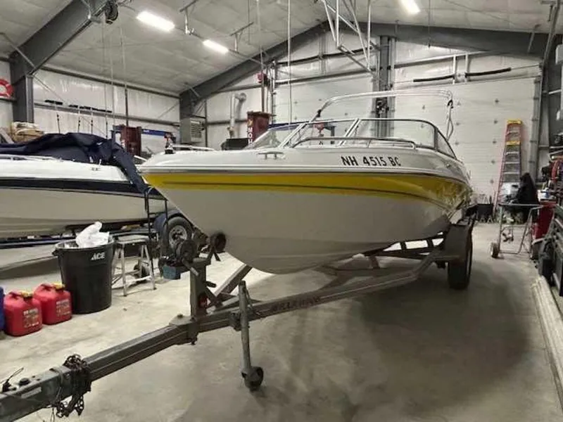 Slide: The Image of 2003 Four Winns 190 Horizon boat on trailer in storage facility. - 4