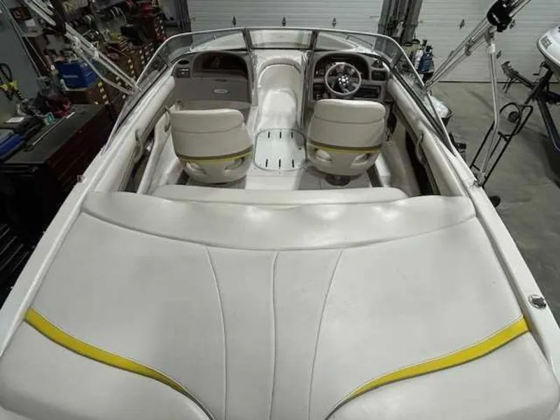 Slide: The Image of 2003 Four Winns 190 Horizon boat interior with white and yellow seating. - 5