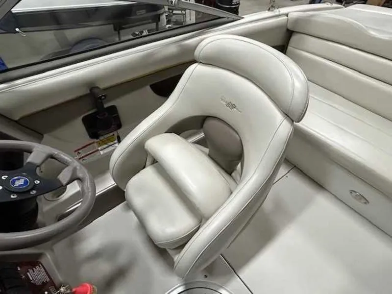 Slide: The Image of 2003 Four Winns 190 Horizon boat interior with white leather seating. - 7