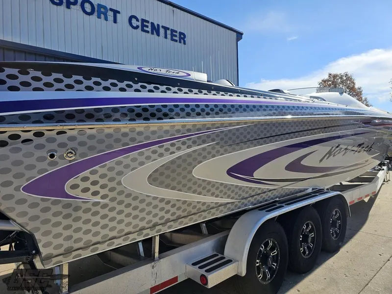 Slide: The Image of 2007 Nor-Tech 3900 Super-VEE boat with sleek design on trailer. - 10