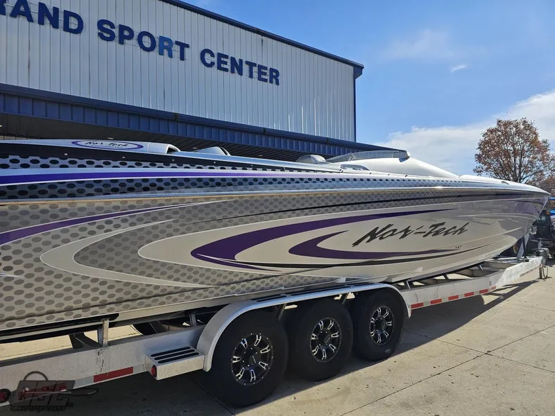 Slide: The Image of 2007 Nor-Tech 3900 Super-VEE boat on trailer at sport center. - 11