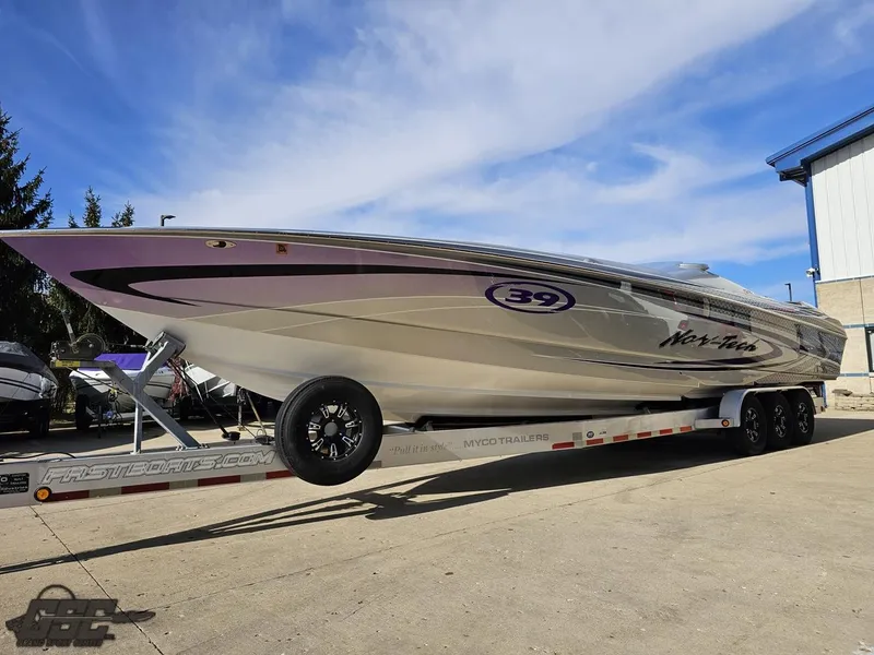 Slide: The Image of 2007 Nor-Tech 3900 Super-VEE speedboat on trailer, parked outdoors under blue sky. - 17