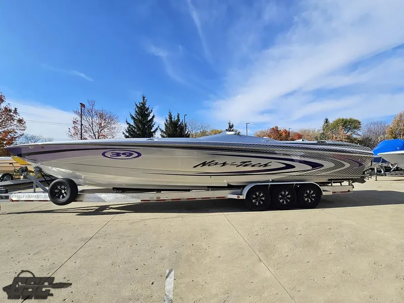 Slide: The Image of 2007 Nor-Tech 3900 Super-VEE speedboat on trailer, parked outdoors under blue sky. - 21