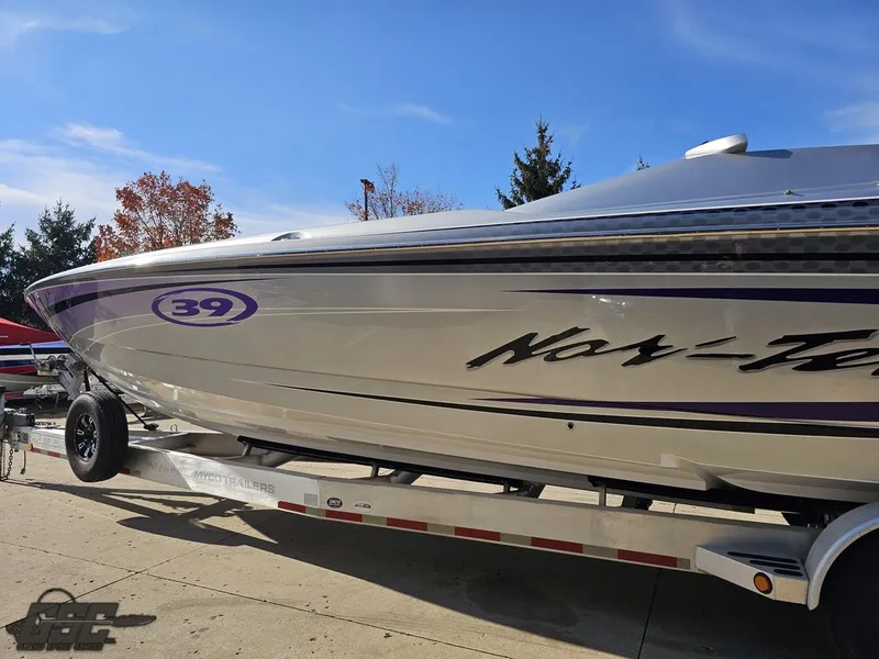 Slide: The Image of 2007 Nor-Tech 3900 Super-VEE boat on trailer, side view, clear sky background. - 22