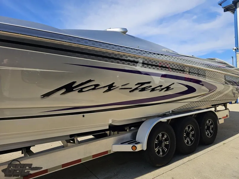 Slide: The Image of 2007 Nor-Tech 3900 Super-VEE boat on trailer, sleek design with custom graphics. - 24