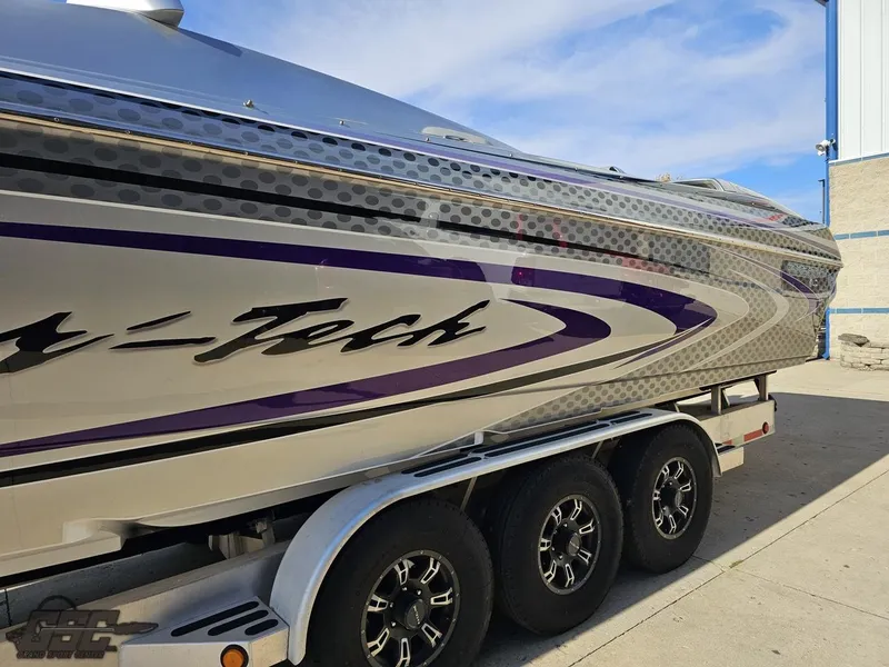 Slide: The Image of 2007 Nor-Tech 3900 Super-VEE boat on trailer, featuring sleek design and vibrant graphics. - 25