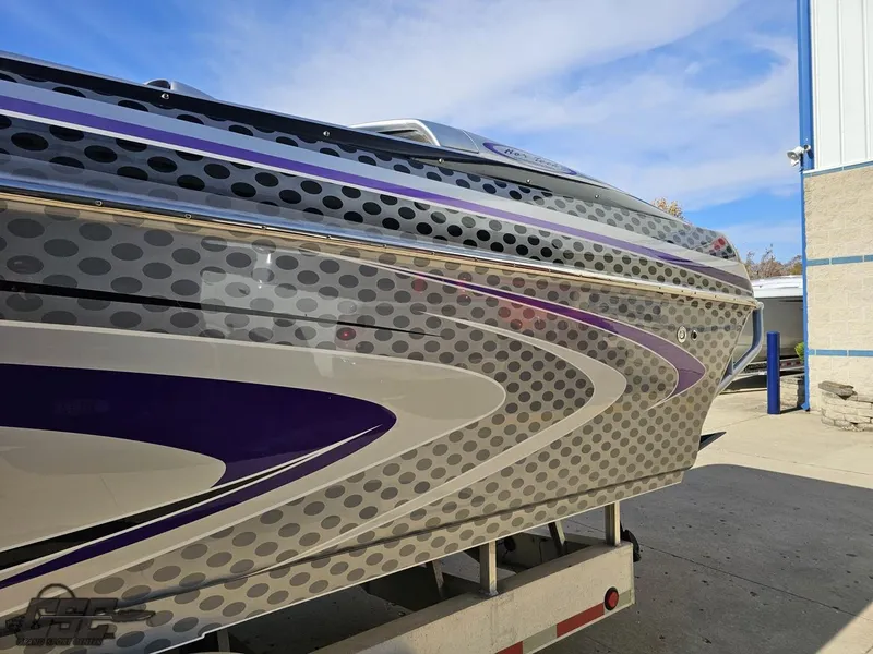 Slide: The Image of 2007 Nor-Tech 3900 Super-VEE boat with sleek, modern design and vibrant graphics. - 26