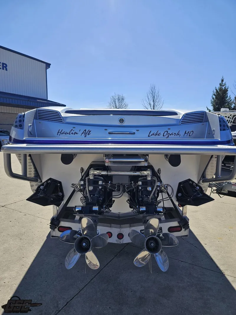 Slide: The Image of 2007 Nor-Tech 3900 Super-VEE boat rear view with dual propellers, parked outdoors. - 29