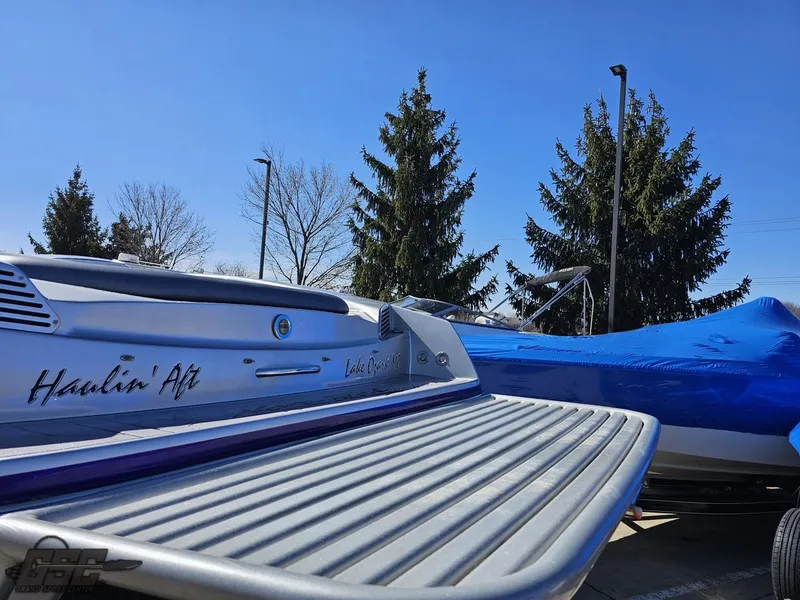Slide: The Image of 2007 Nor-Tech 3900 Super-VEE boat with custom graphics, parked outdoors. - 32