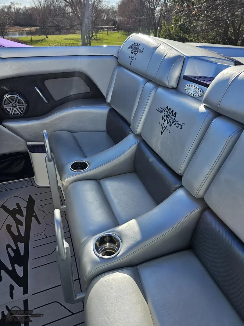 Slide: The Image of 2007 Nor-Tech 3900 Super-VEE boat interior with gray leather seating and cup holders. - 45