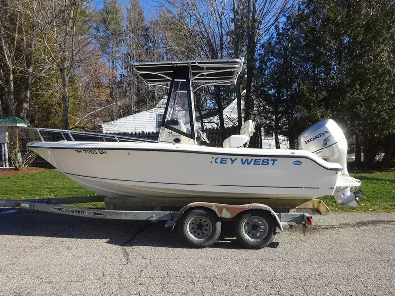 Slide: The Image of 2006 Key West 186 Sportsman boat on trailer with Honda outboard motor. - 12