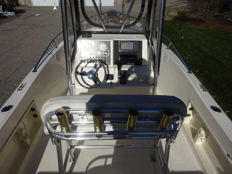 Slide: The Image of 2006 Key West 186 Sportsman boat interior with steering console and rod holders. - 15